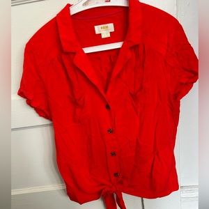 Bright red Maeve button down top with tie on the bottom